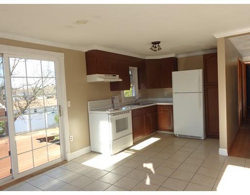 22 Albee Street Springfield, MA 01129 - Photo 6 of 11 a kitchen with a refrigerator sink and cabinets