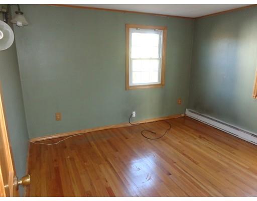 22 Albee Street Springfield, MA 01129 - Photo 7 of 11 an empty room with wooden floor and windows