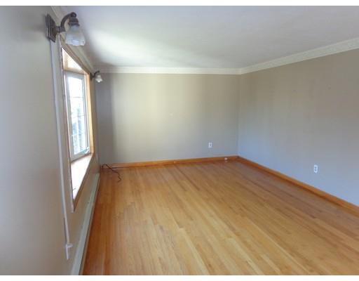 22 Albee Street Springfield, MA 01129 - Photo 8 of 11 a view of empty room with wooden floor and fan