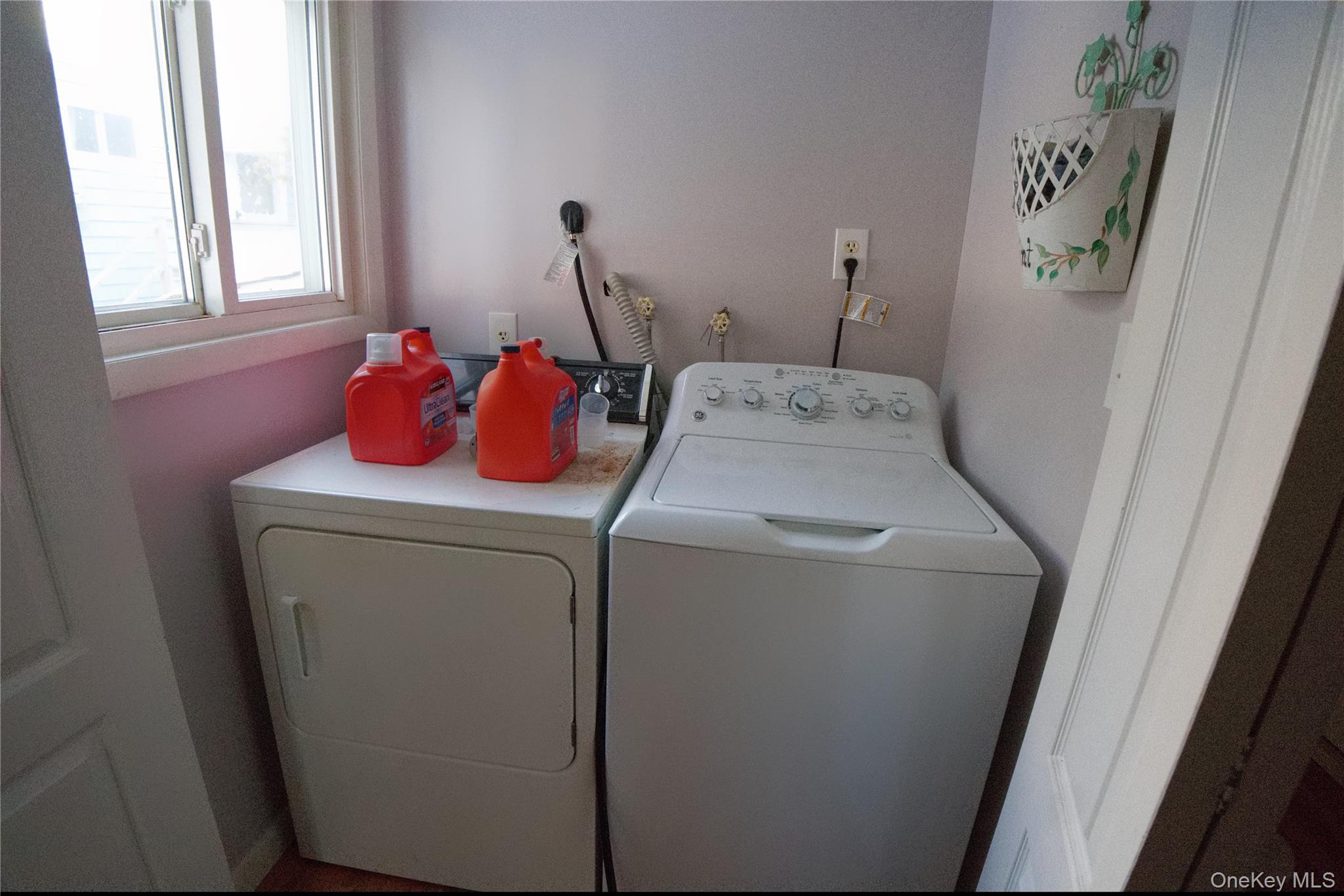215 Lakeside Trail Ridge, NY 11961 - Photo 21 of 24 a utility room with dryer and washer