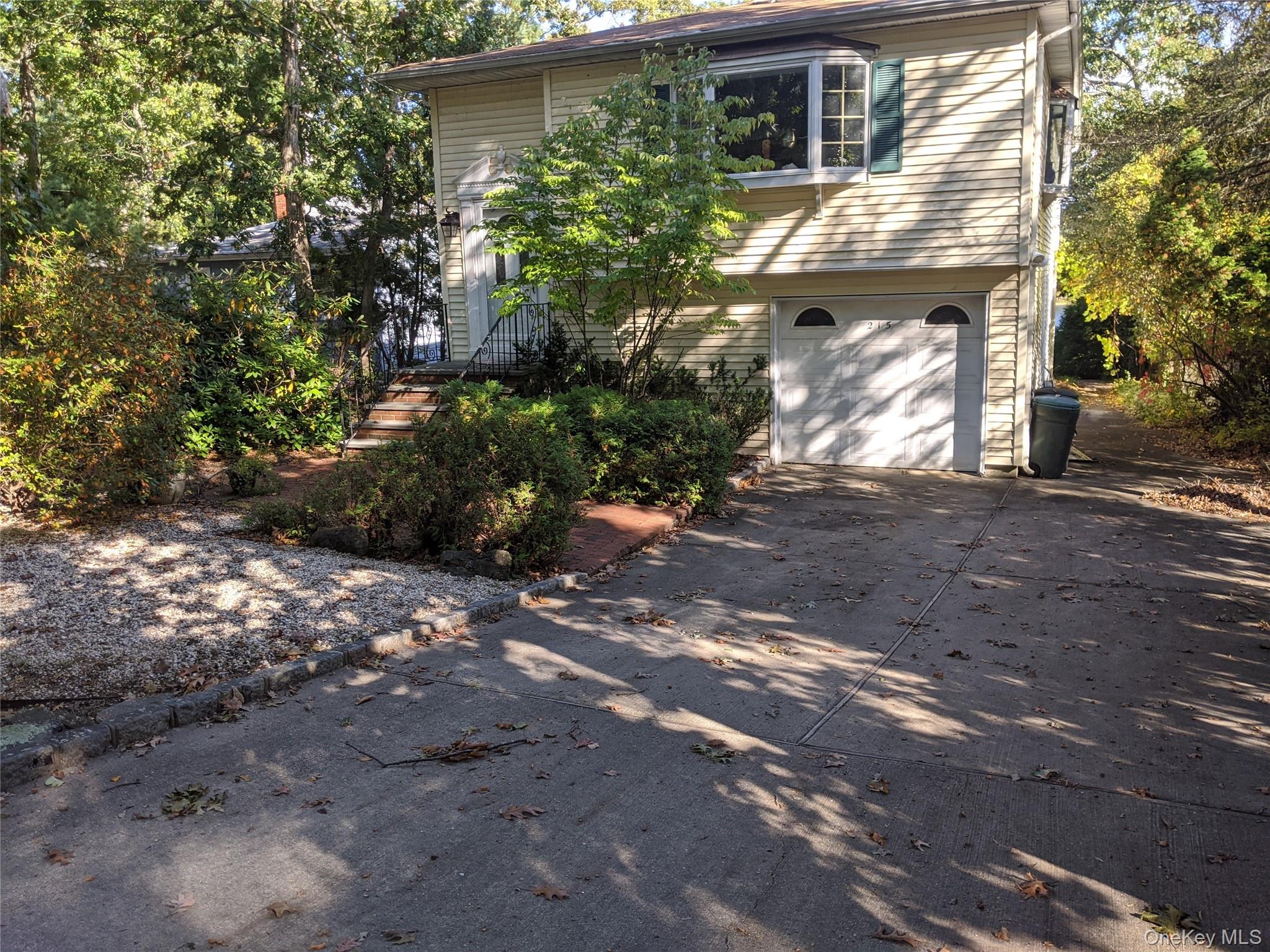 215 Lakeside Trail Ridge, NY 11961 - Photo 24 of 24 a view of a house with a yard