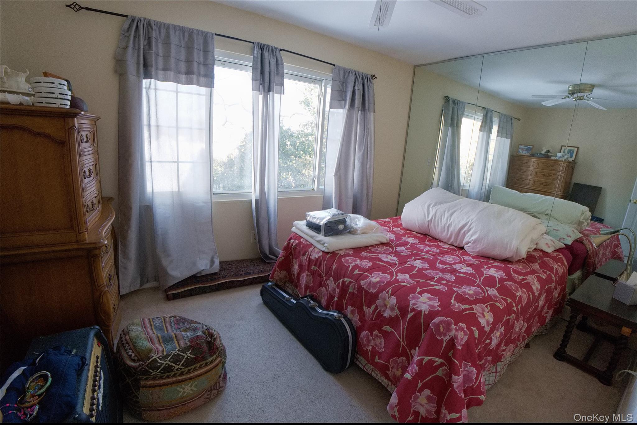 215 Lakeside Trail Ridge, NY 11961 - Photo 10 of 24 a bedroom with a bed and a window