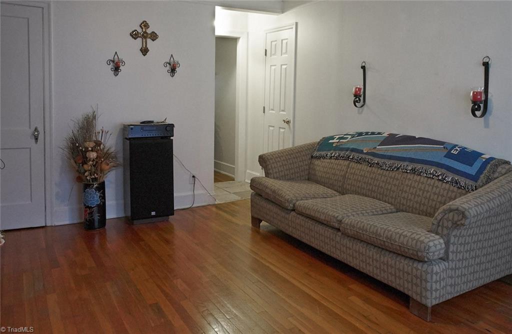 408 Hickory Chapel Road High Point, NC 27260 - Photo 2 of 23 Beautiful hardwoods and wide moldings add lots of charm in living room. Large coat closet on left. Closed door on upper right is a full bath.