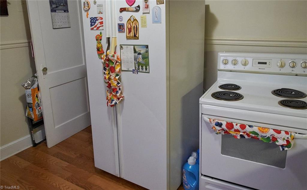 408 Hickory Chapel Road High Point, NC 27260 - Photo 9 of 23 Freestanding stove and refrigerator belong to the tenant and do not remain with the home.