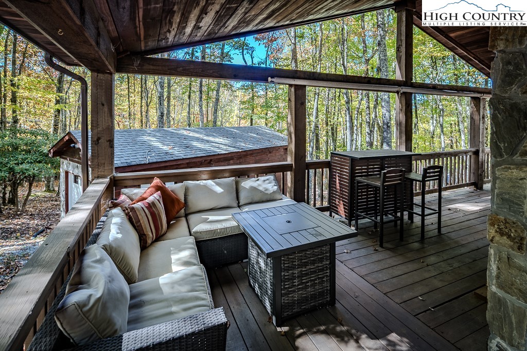 719 Pine Ridge Road Beech Mountain, NC 28604 - Photo 23 of 32 a view of a dining room with furniture window and outside view