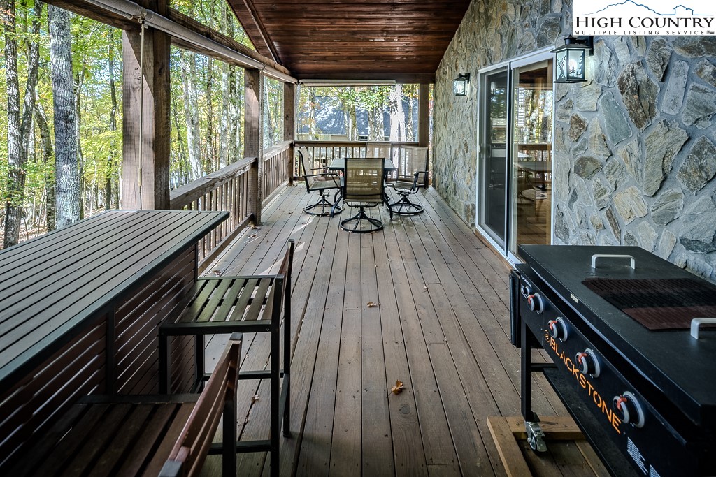 719 Pine Ridge Road Beech Mountain, NC 28604 - Photo 25 of 32 a view of a balcony with chairs