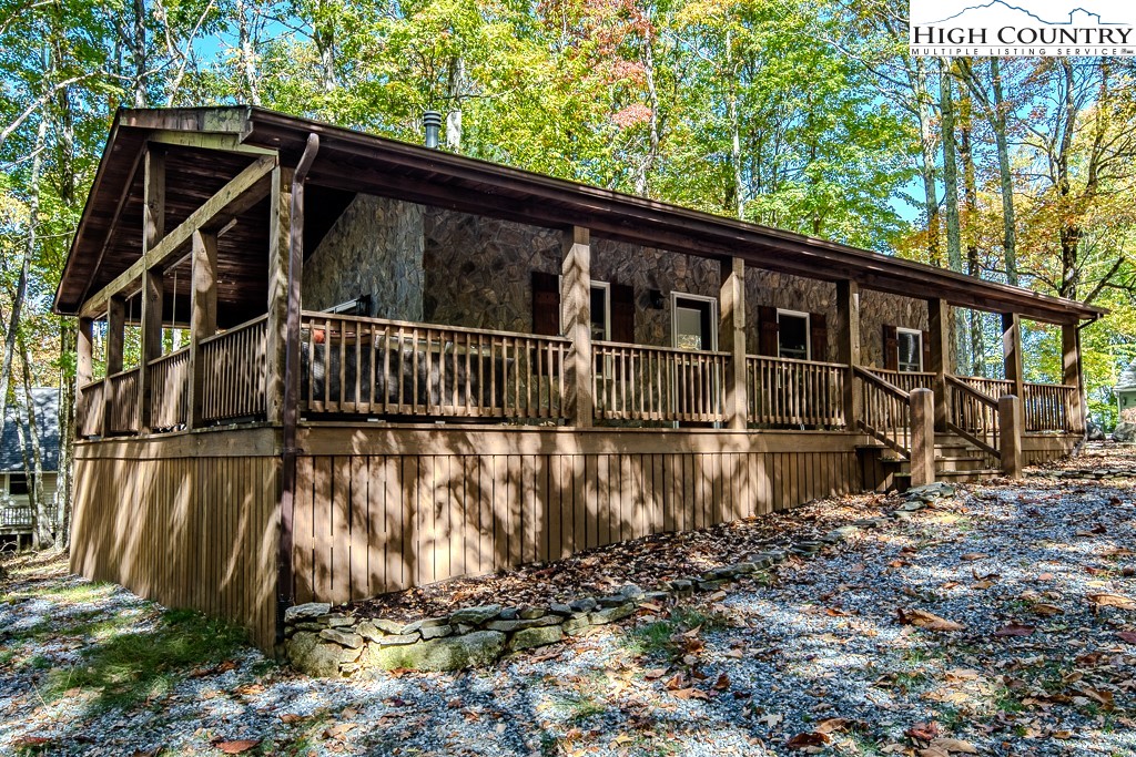 719 Pine Ridge Road Beech Mountain, NC 28604 - Photo 27 of 32 a view of a house with a yard