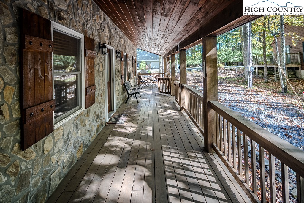 719 Pine Ridge Road Beech Mountain, NC 28604 - Photo 4 of 32 a view of balcony with wooden floor