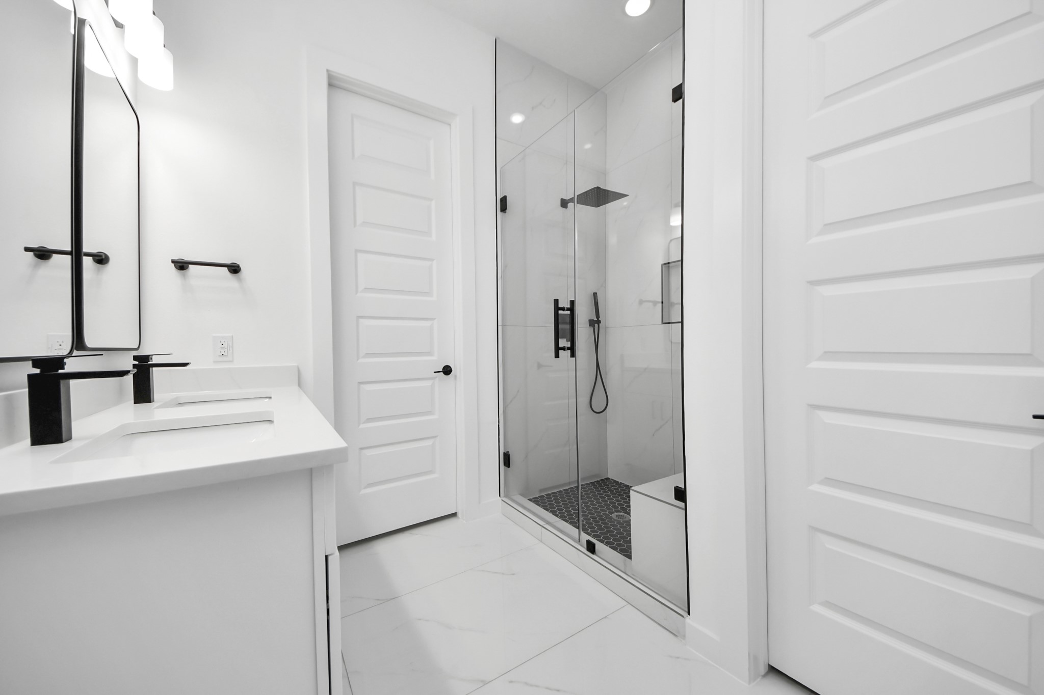 7935 Sunnyhill Street Houston, TX 77088 - Photo 12 of 21 a bathroom with a sink and a mirror