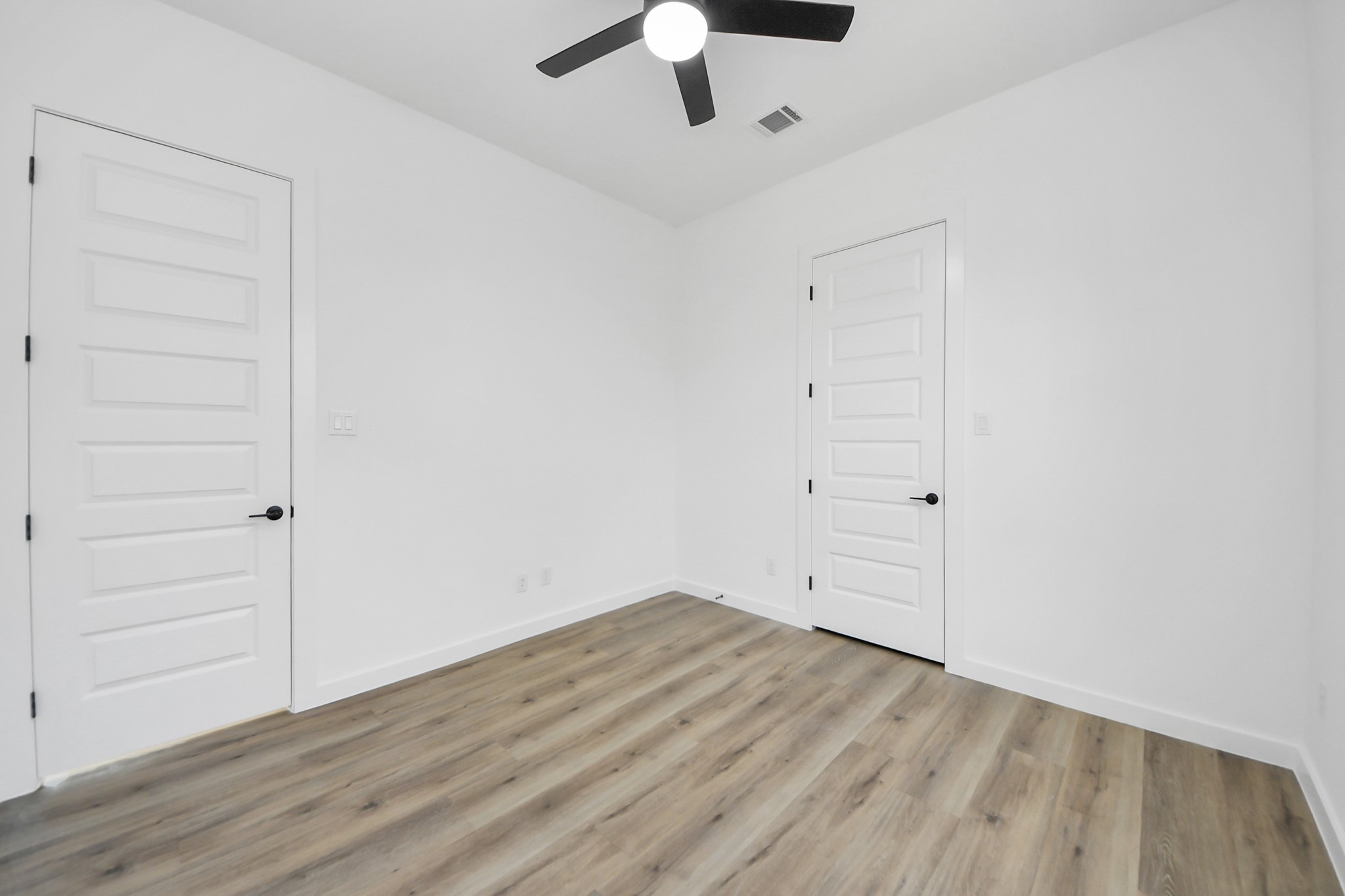 7935 Sunnyhill Street Houston, TX 77088 - Photo 14 of 21 wooden floor in an empty room
