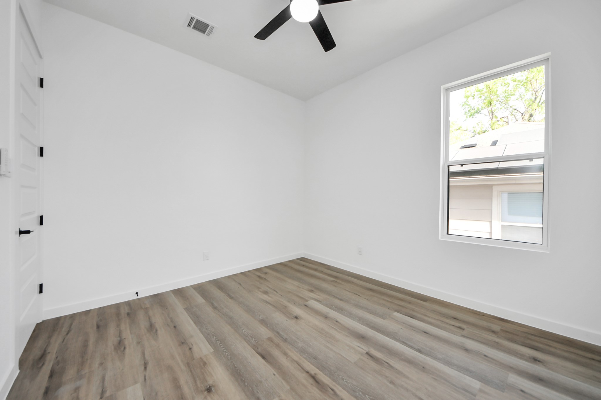 7935 Sunnyhill Street Houston, TX 77088 - Photo 15 of 21 an empty room with a window
