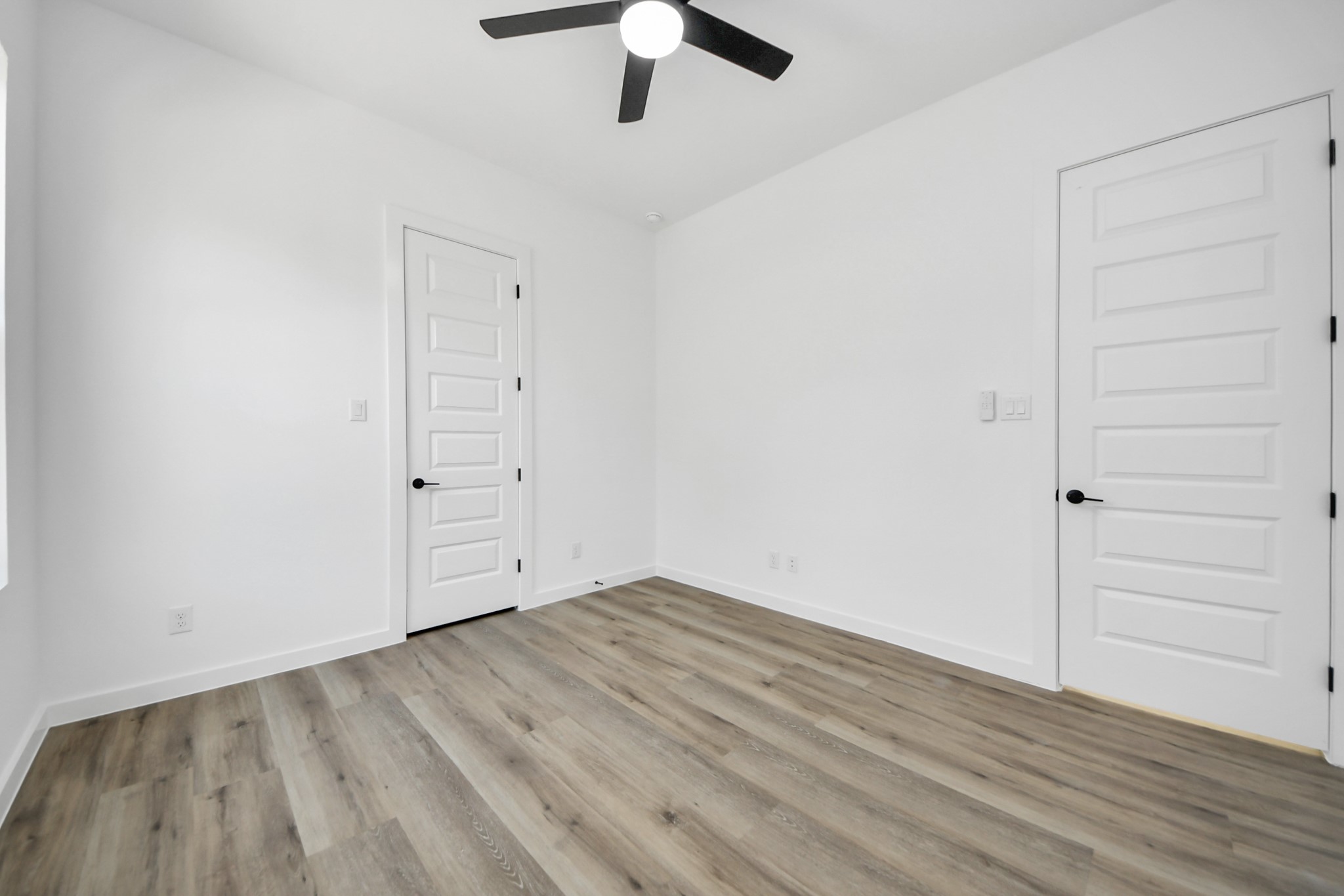 7935 Sunnyhill Street Houston, TX 77088 - Photo 17 of 21 wooden floor in an empty room