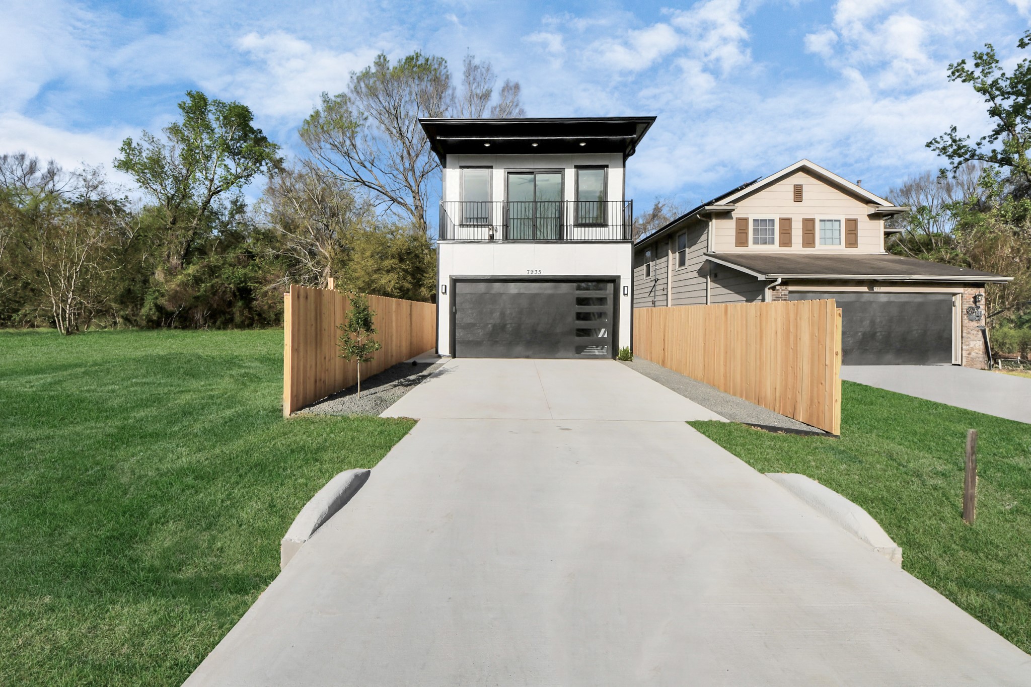 7935 Sunnyhill Street Houston, TX 77088 - Photo 2 of 21 a front view of a house with yard and green space