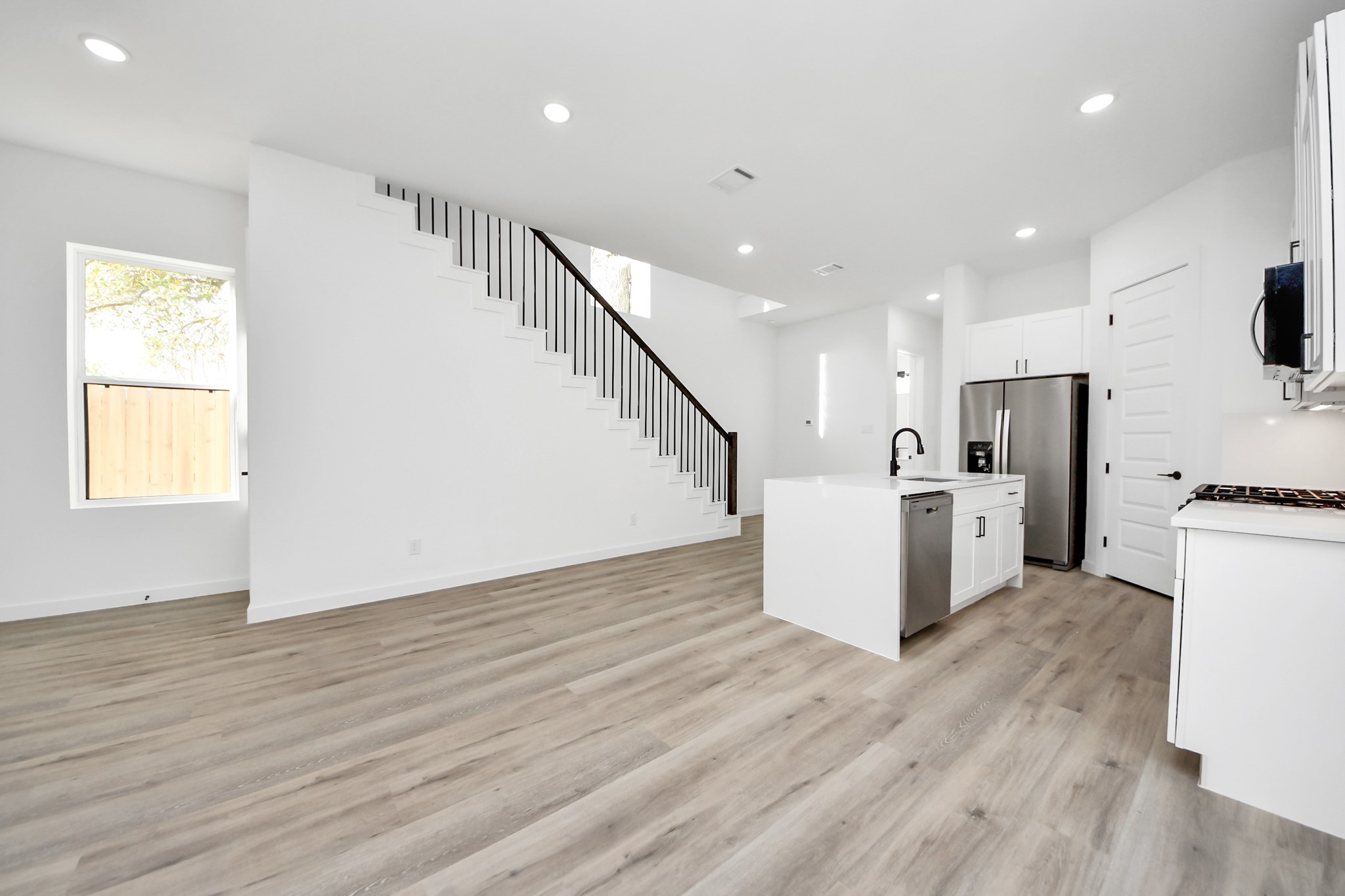 7935 Sunnyhill Street Houston, TX 77088 - Photo 5 of 21 a view of kitchen with furniture and wooden floor