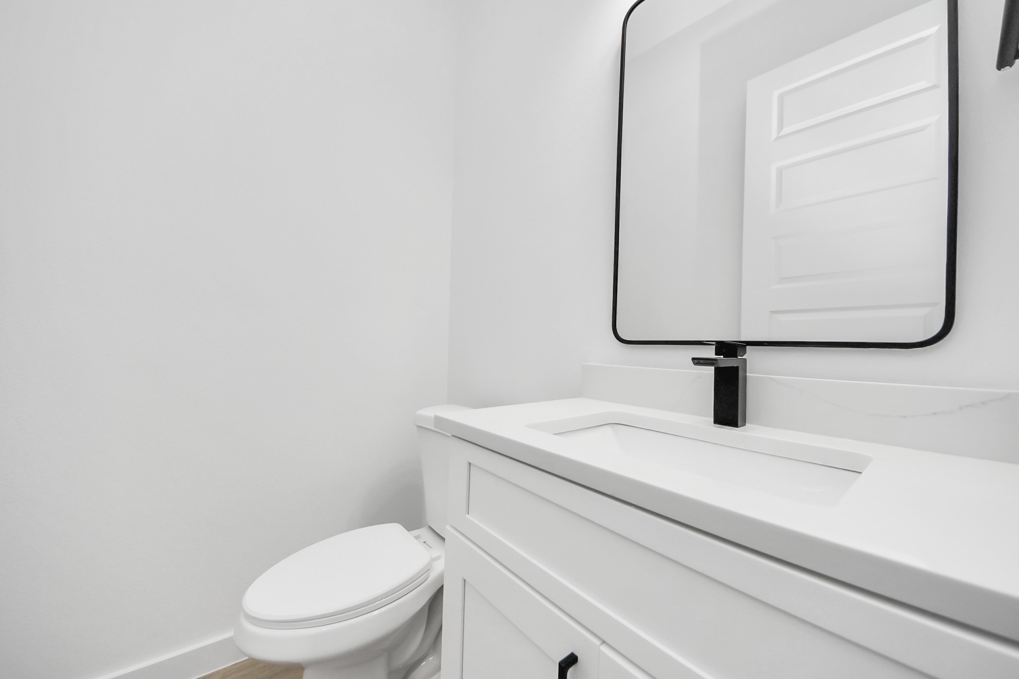 7935 Sunnyhill Street Houston, TX 77088 - Photo 8 of 21 a bathroom with a toilet sink and mirror