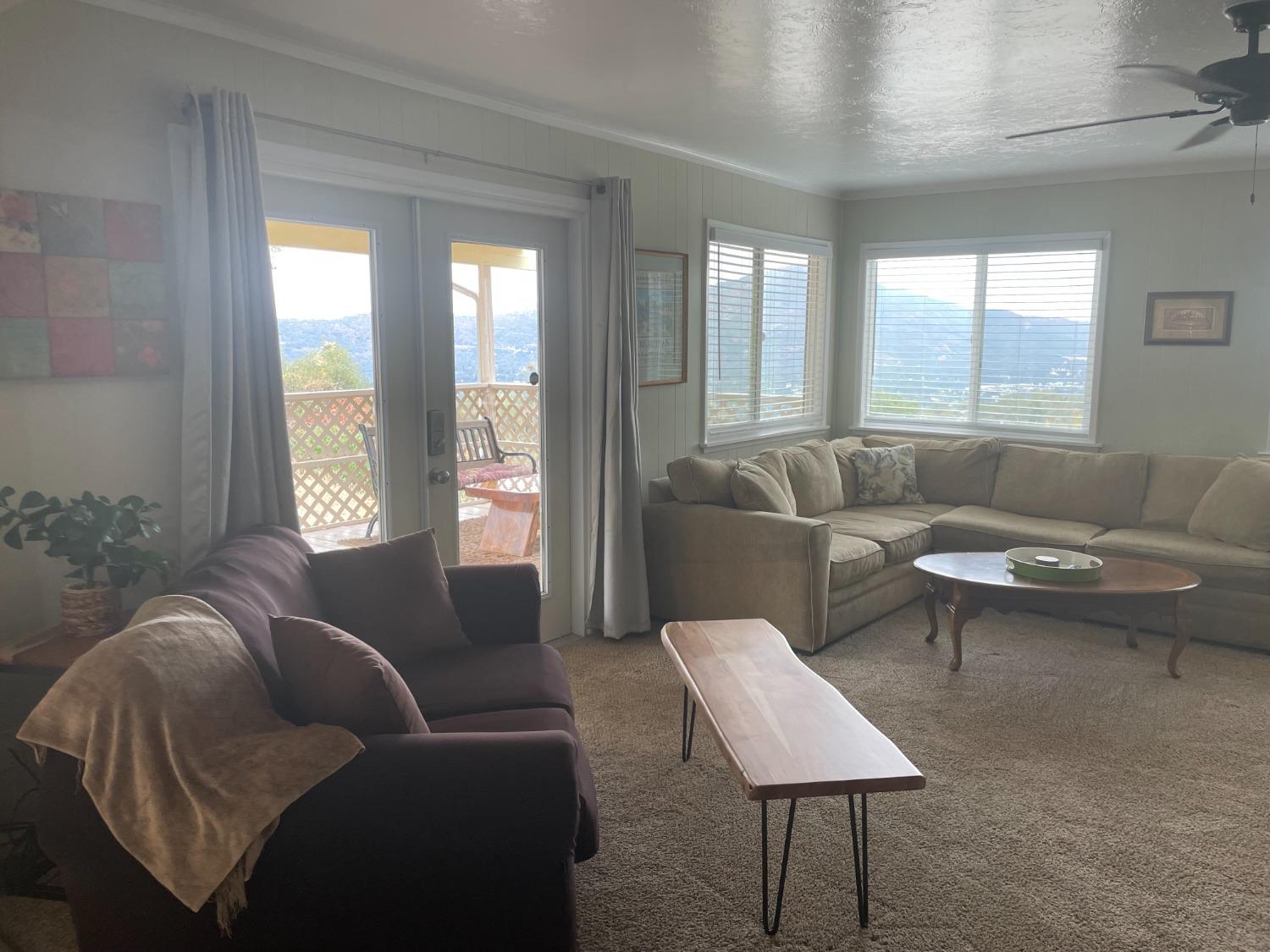 40640 Taylor Mountain Road Oakhurst, CA 93644 - Photo 14 of 62 a living room with furniture and a large window