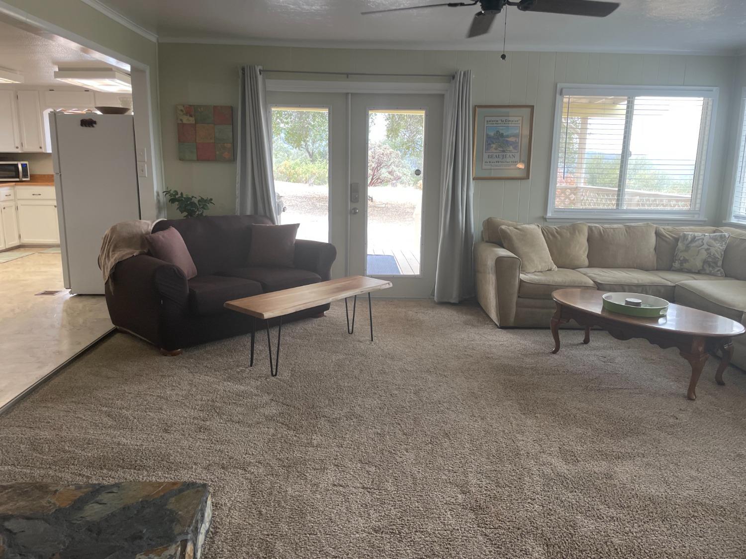 40640 Taylor Mountain Road Oakhurst, CA 93644 - Photo 15 of 62 a living room with furniture and a large window