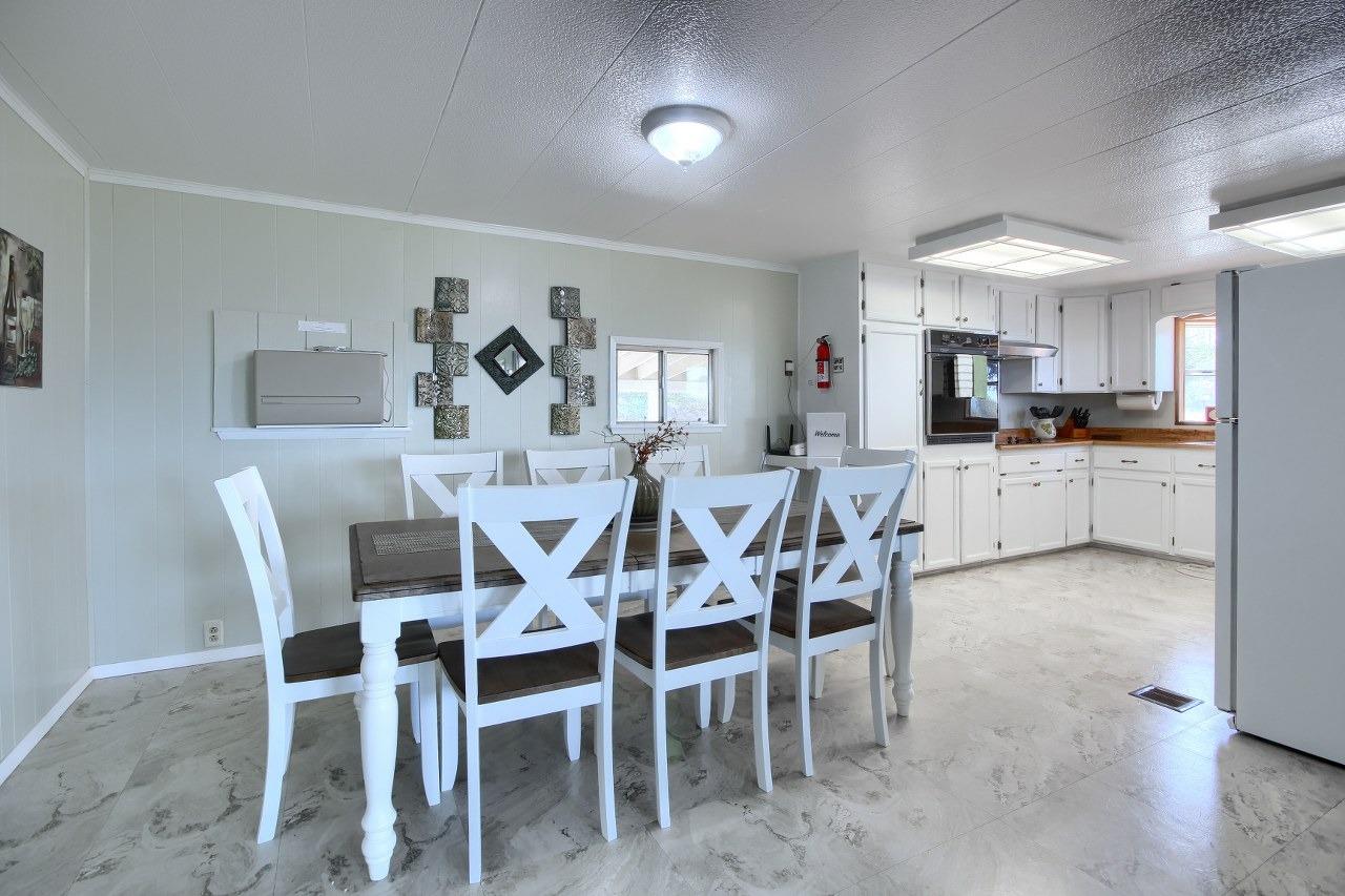 40640 Taylor Mountain Road Oakhurst, CA 93644 - Photo 17 of 62 a view of a dining room with furniture and wooden floor