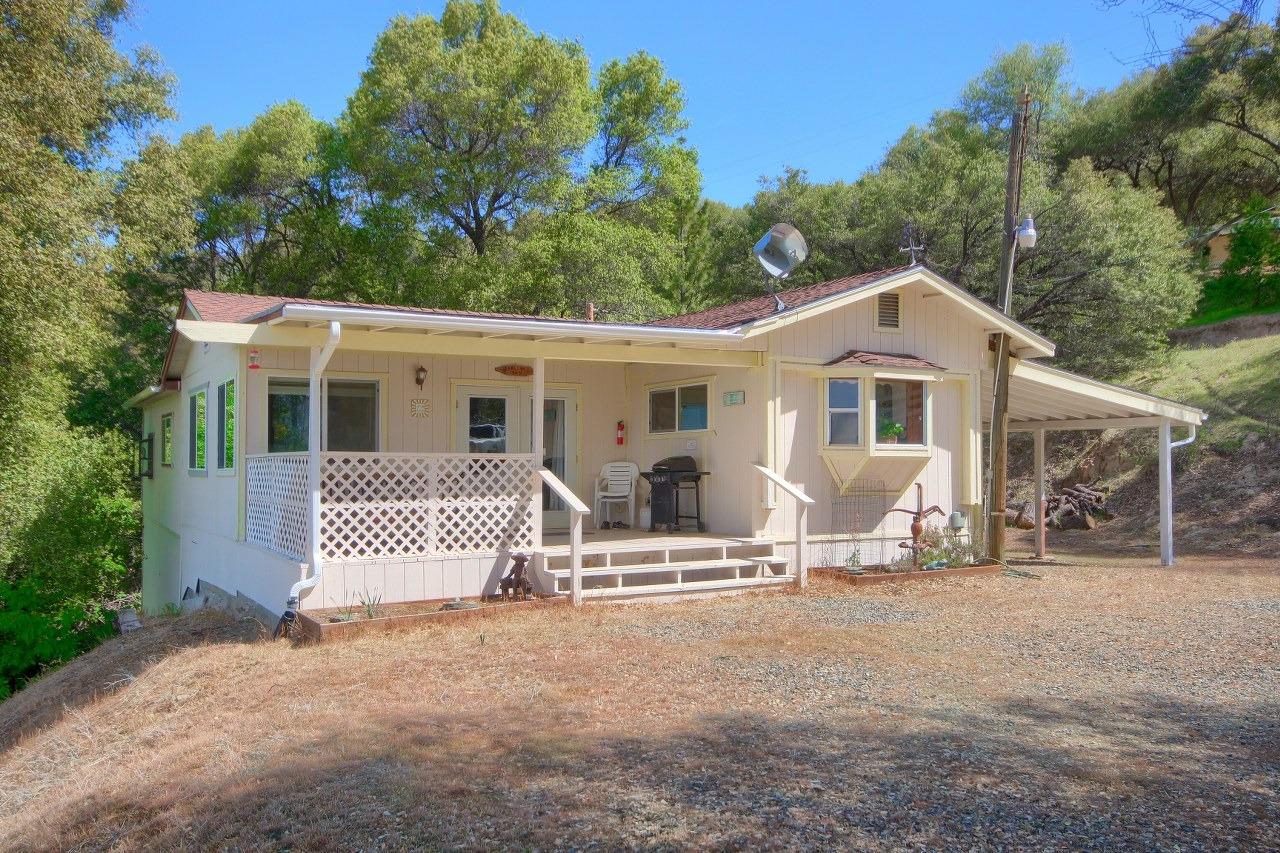 40640 Taylor Mountain Road Oakhurst, CA 93644 - Photo 45 of 62 a front view of a house with a yard