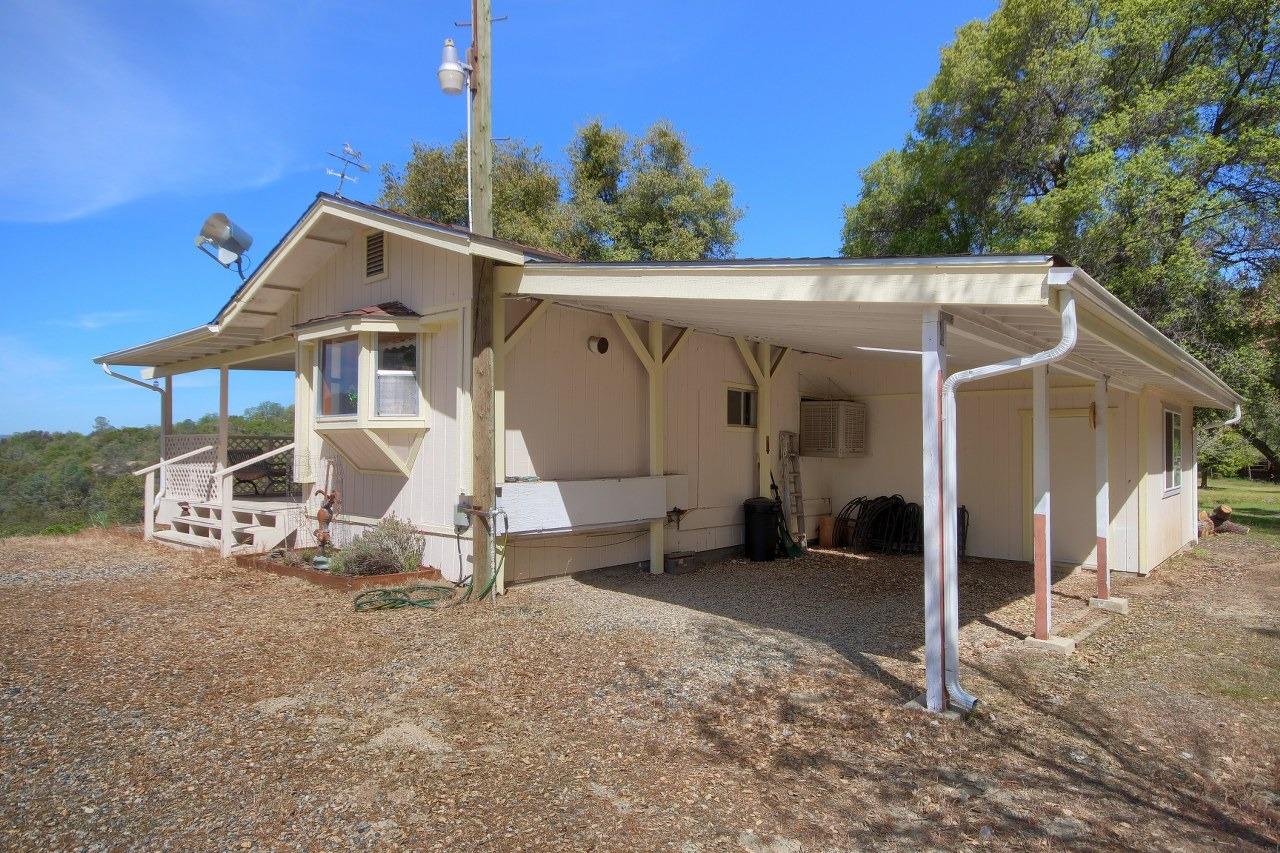 40640 Taylor Mountain Road Oakhurst, CA 93644 - Photo 46 of 62 a view of a house with backyard