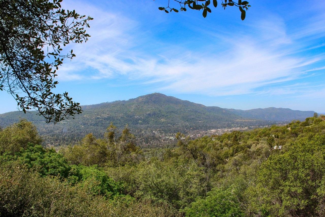 40640 Taylor Mountain Road Oakhurst, CA 93644 - Photo 47 of 62 a view of a mountain range with trees in the background