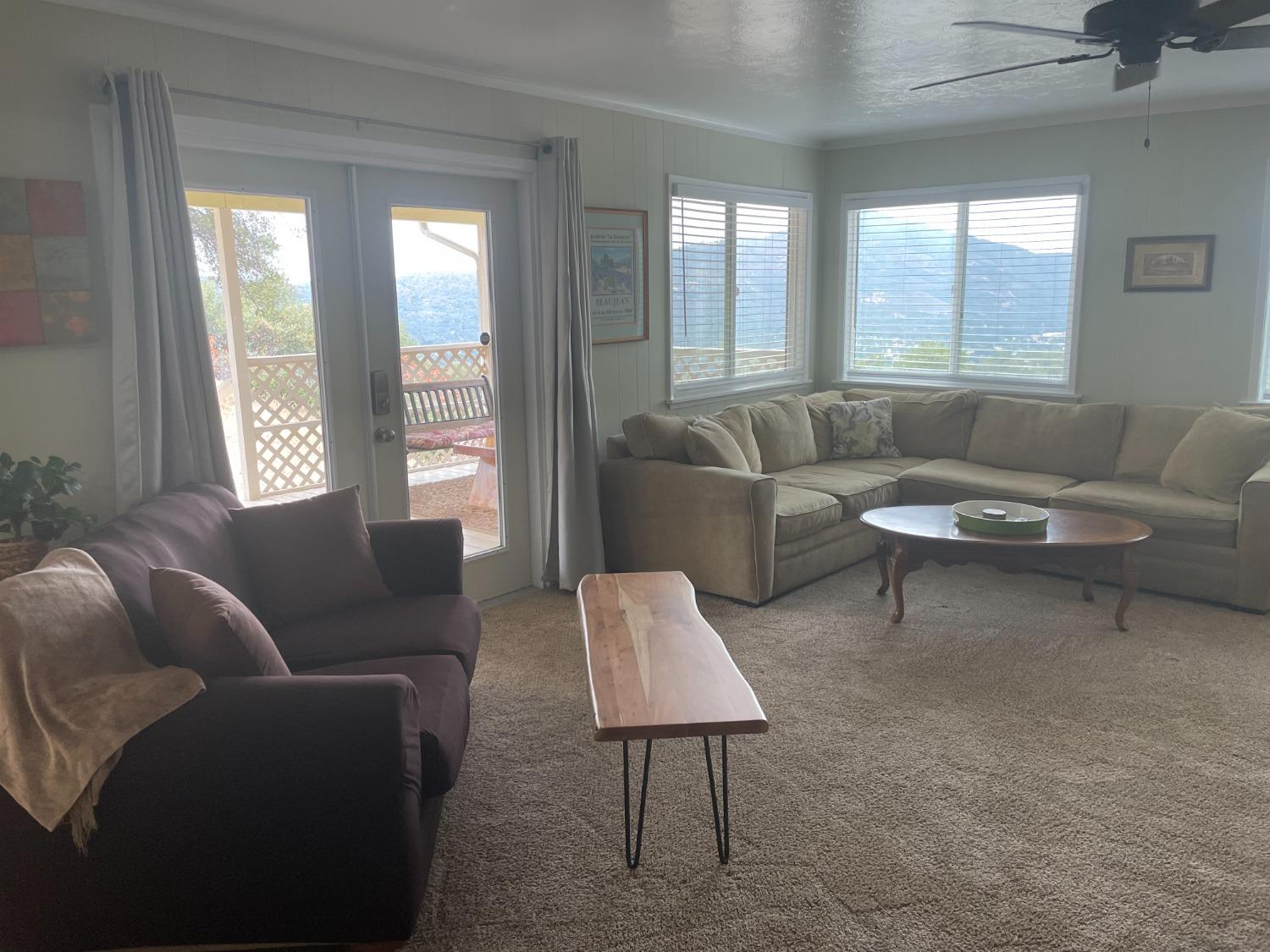 40640 Taylor Mountain Road Oakhurst, CA 93644 - Photo 8 of 62 a living room with furniture and a large window