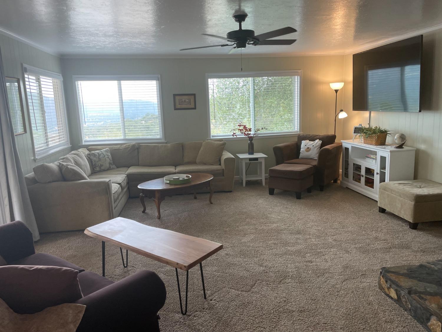 40640 Taylor Mountain Road Oakhurst, CA 93644 - Photo 10 of 62 a living room with furniture and a large window