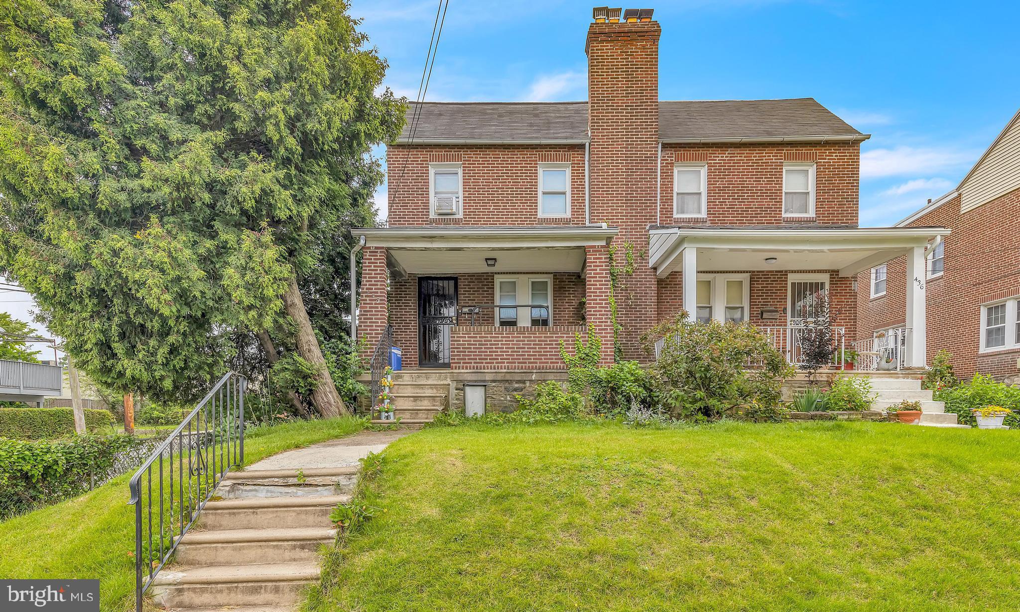 438 Holly Road Lansdowne, PA 19050 - Photo 1 of 17 a front view of a house with garden