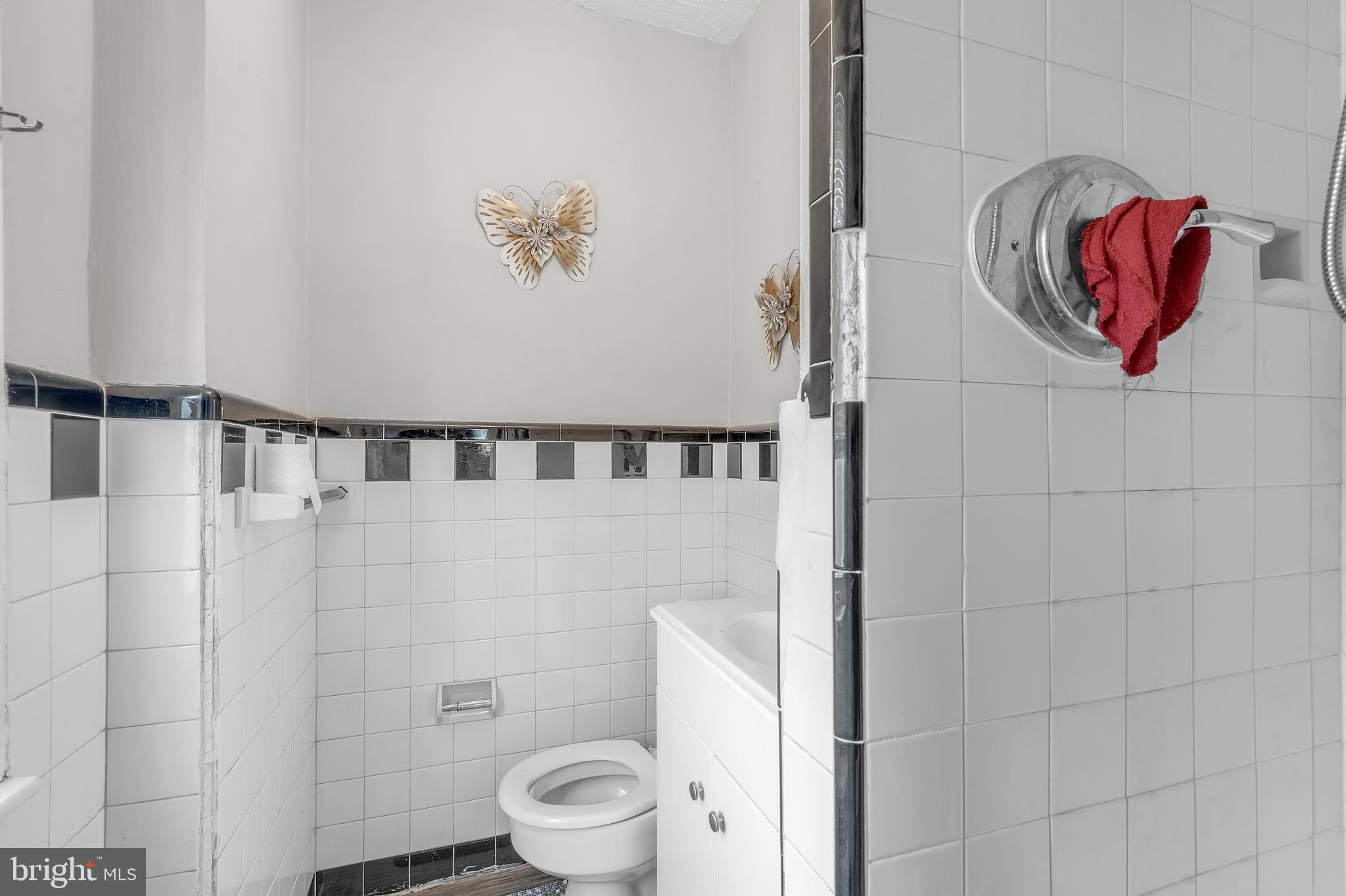 438 Holly Road Lansdowne, PA 19050 - Photo 11 of 17 a bathroom with a toilet and a shower