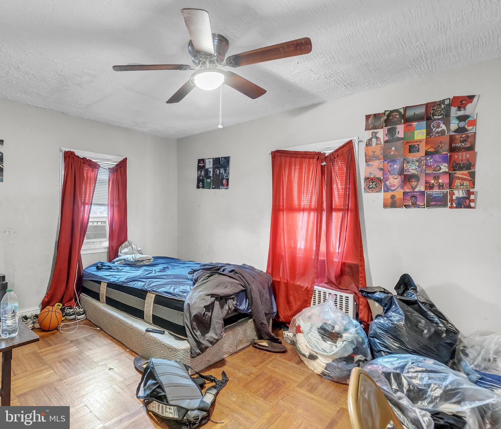 438 Holly Road Lansdowne, PA 19050 - Photo 13 of 17 a bedroom with a bed and a chandelier