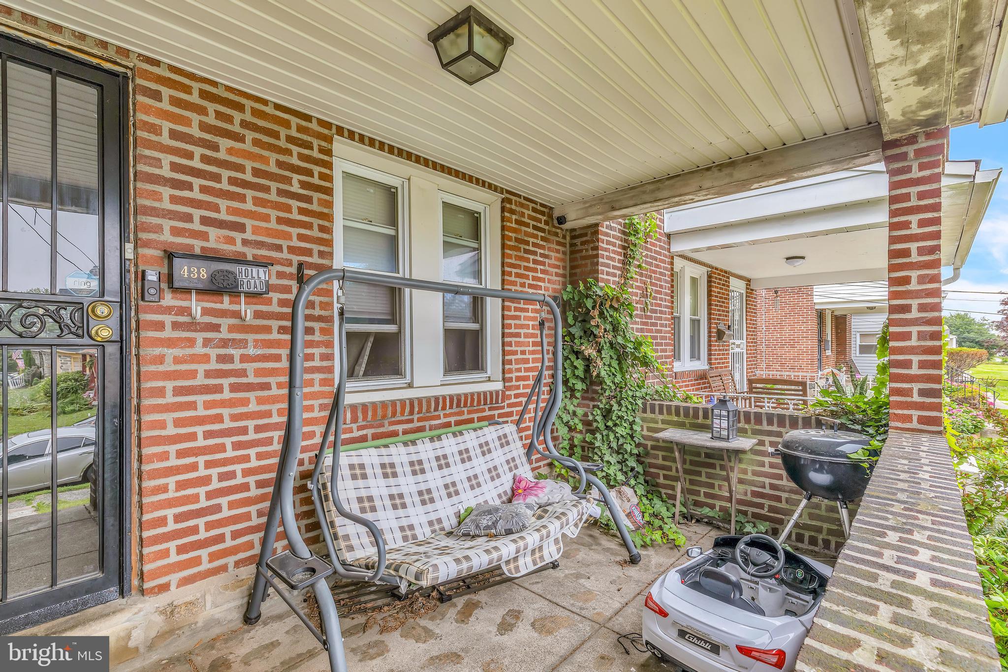 438 Holly Road Lansdowne, PA 19050 - Photo 15 of 17 a balcony with furniture and flowers