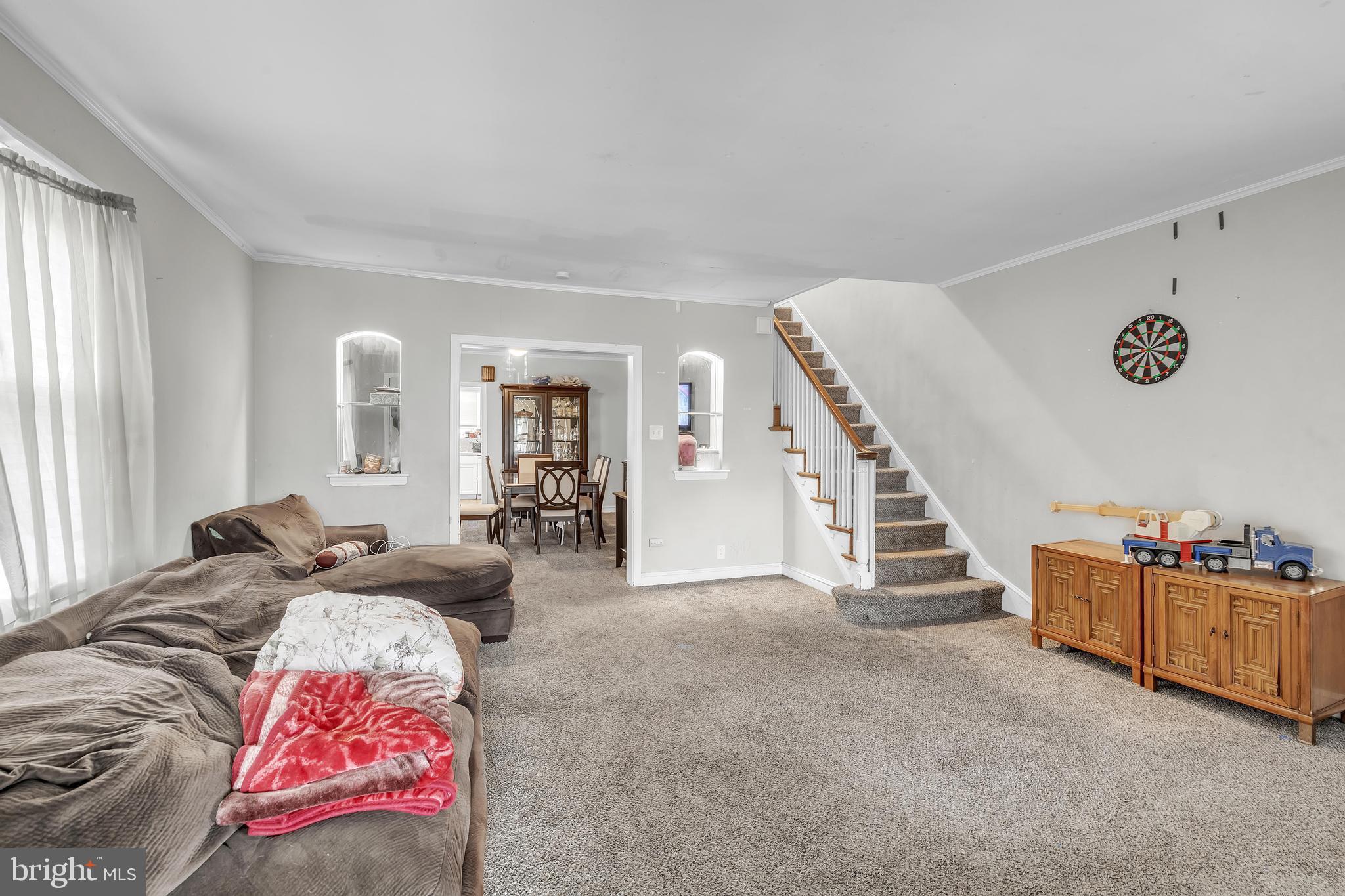 438 Holly Road Lansdowne, PA 19050 - Photo 3 of 17 a living room with furniture and stairs