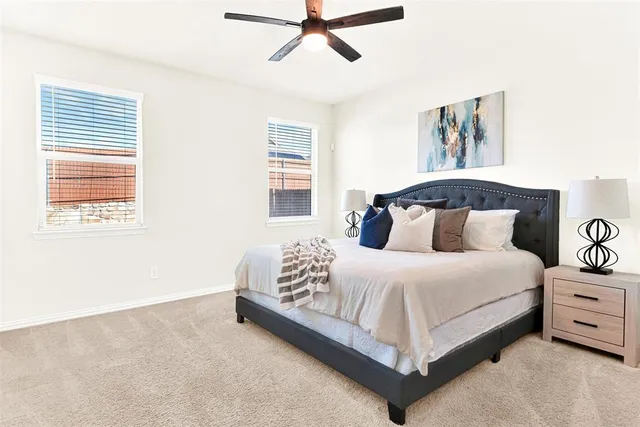 a bedroom with a bed and window