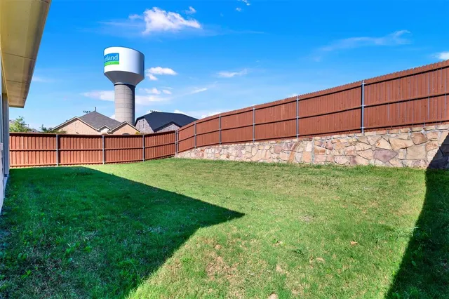 a view of a backyard with plants