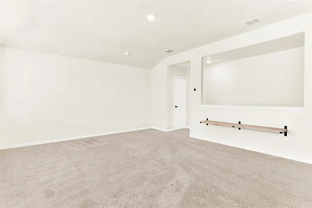 a view of a big room with closet and mirror