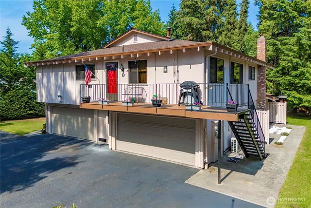a view of house with swimming pool outdoor seating area and barbeque oven