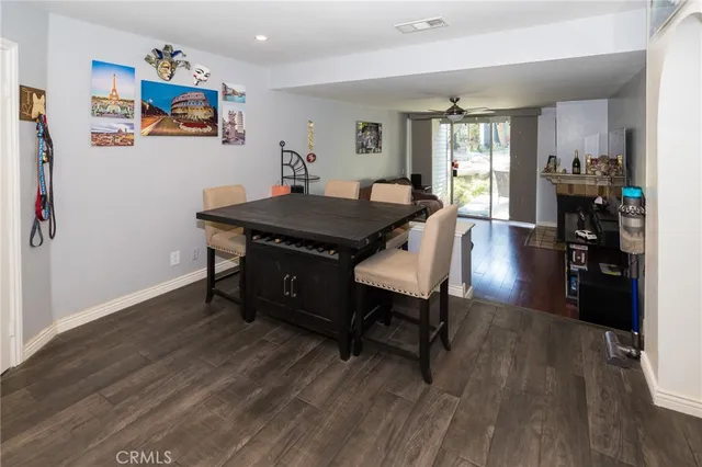 a view of a room with furniture and wooden floor