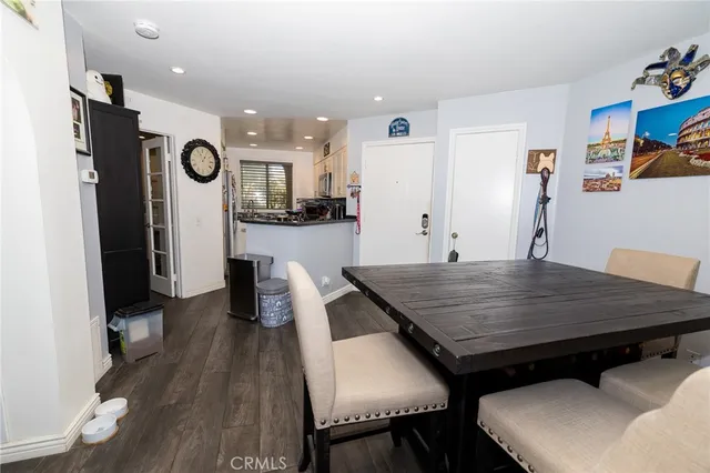 a dining hall with stainless steel appliances furniture