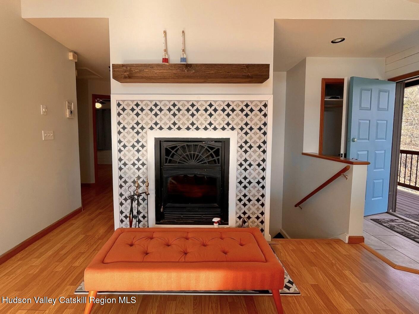 1367 Sleepy Hollow Road Athens, NY 12015 - Photo 2 of 28 a room with a bed and a fireplace