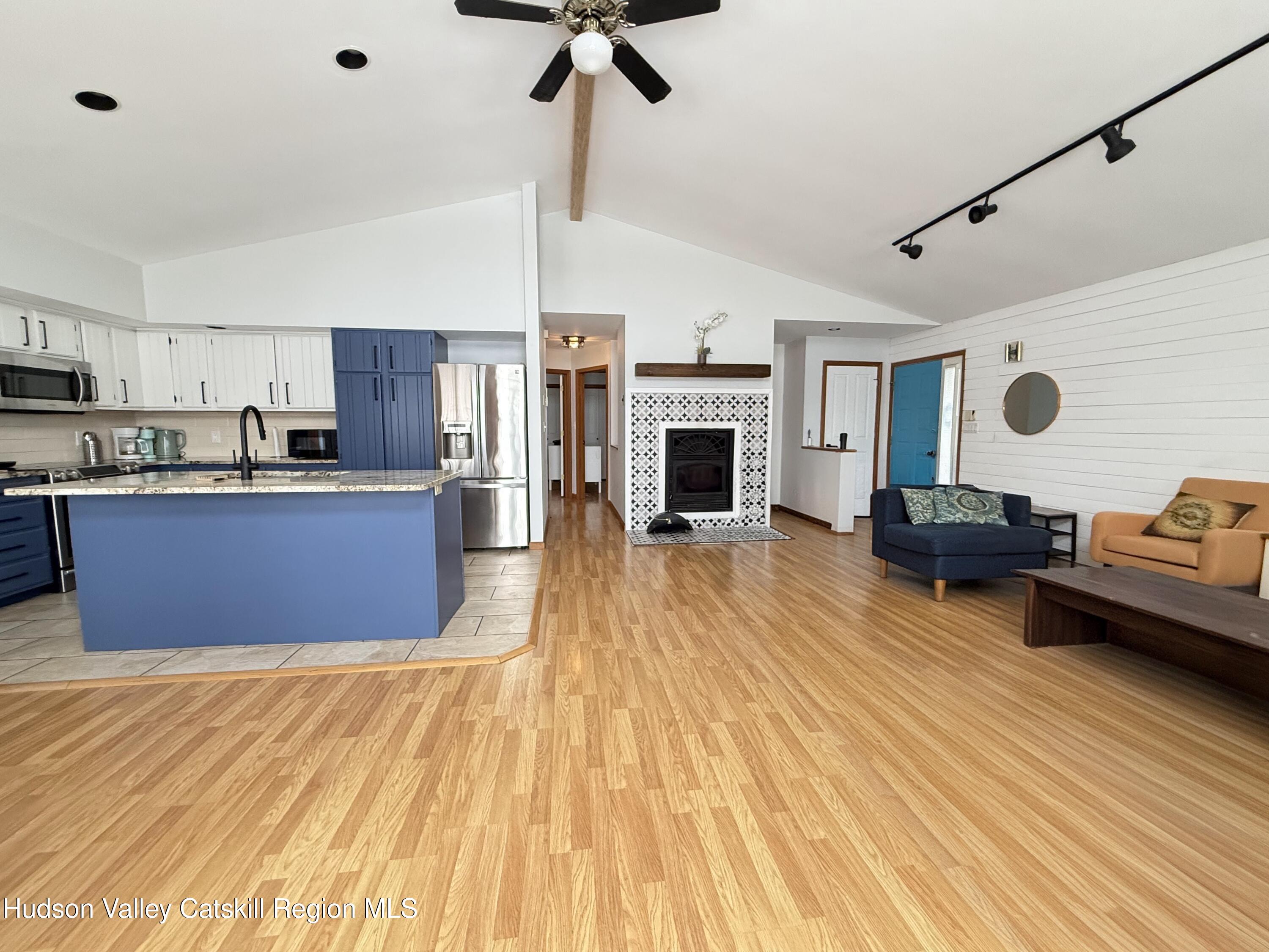 1367 Sleepy Hollow Road Athens, NY 12015 - Photo 27 of 28 a kitchen with stainless steel appliances kitchen island granite countertop a stove and a wooden floors