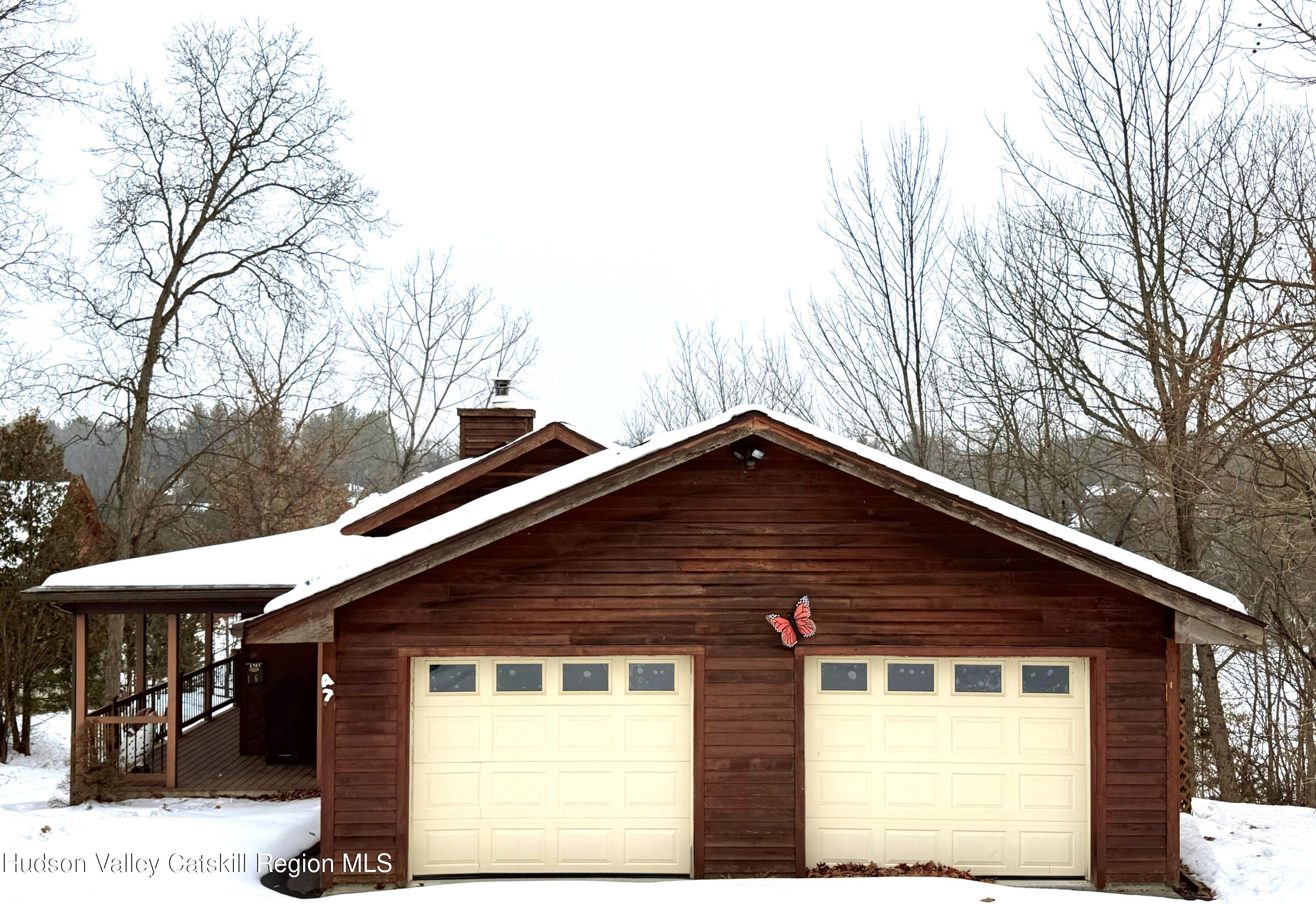 1367 Sleepy Hollow Road Athens, NY 12015 - Photo 28 of 28 a front view of a house with a garden
