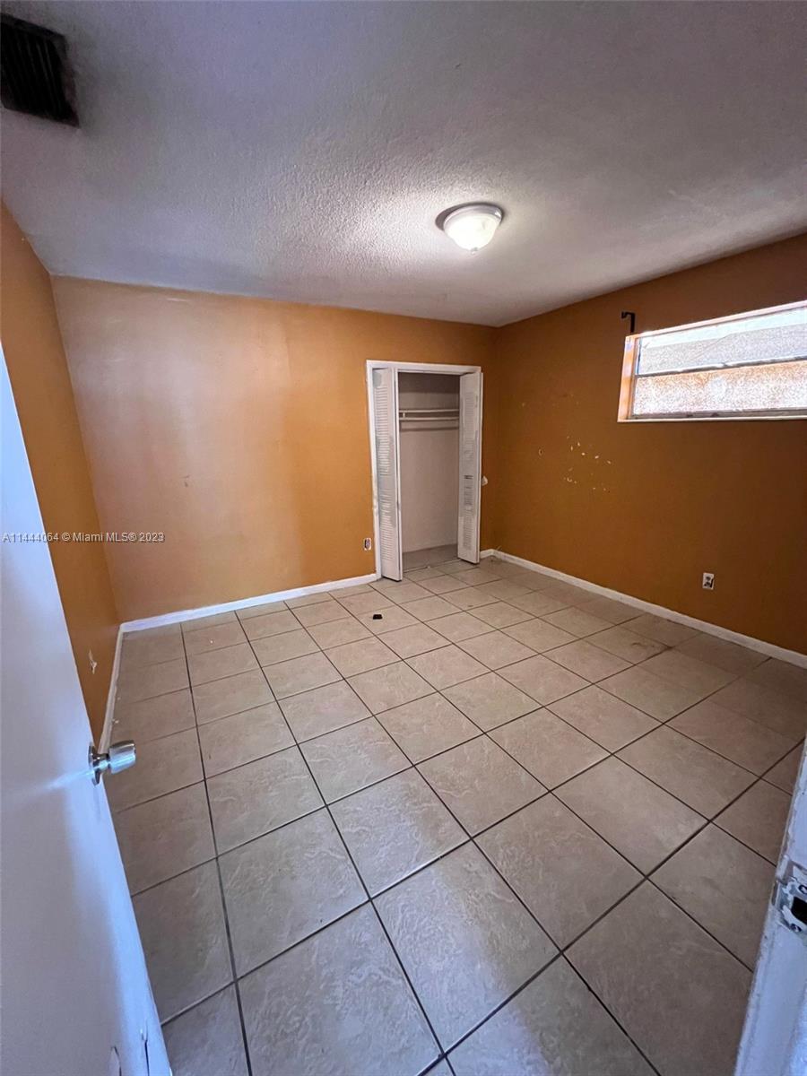 2315 Northwest 33rd Street, Unit 1 Miami, FL 33142 - Photo 5 of 7 a view of an empty room
