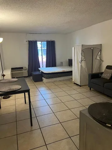 a view of a livingroom with furniture and window