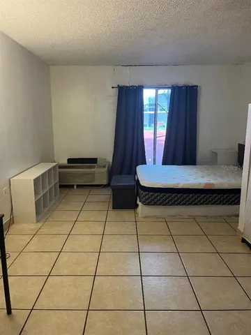 a room with chairs and window