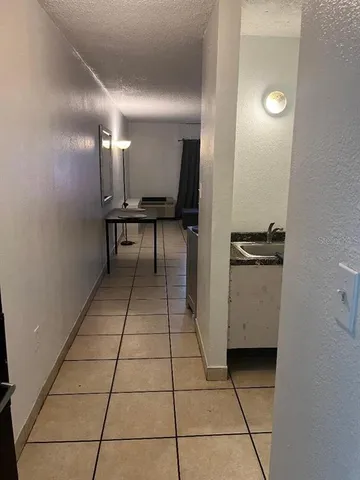 a view of a hallway with seating area