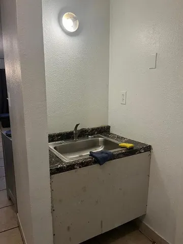 a close up view of a sink a stove and washer