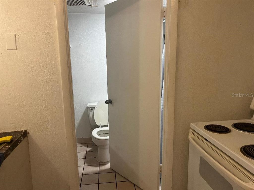 8421 South Orange Blossom Trail, Unit 303 Orlando, FL 32809 - Photo 6 of 15 a bathroom with a toilet and a sink