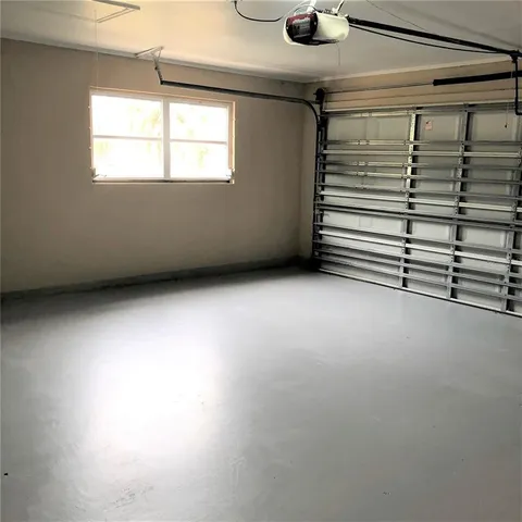 a view of a house with backyard and porch