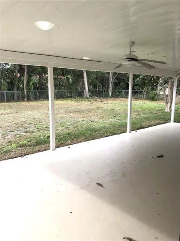 a view of a patio with a yard