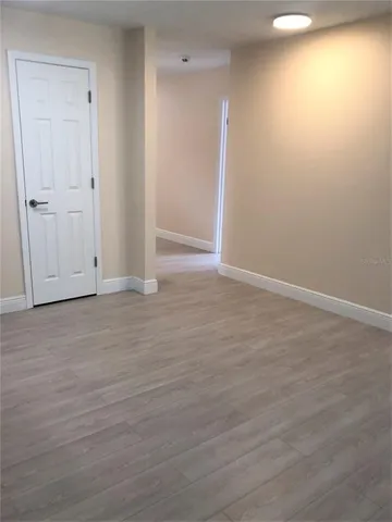 a kitchen with granite countertop a sink and steel appliances